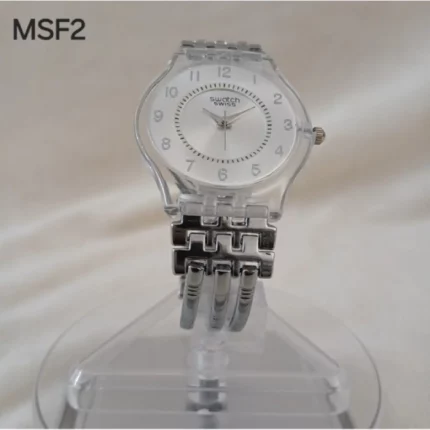 montre femme élégante swatch avec cadran transparent blanc