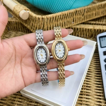 montre femme cadran ovale style vintage chiffres romains rolex doré argent